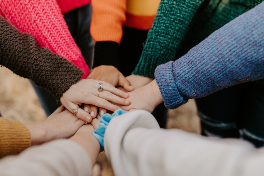 hannah-busing-Zyx1bK9mqmA-unsplash teamwork hands
